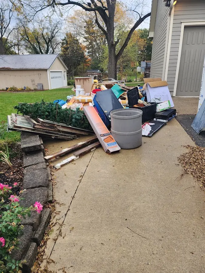 Dumpster being loaded with debris for 30 Yard Dumpster Rental in Ridge Manor